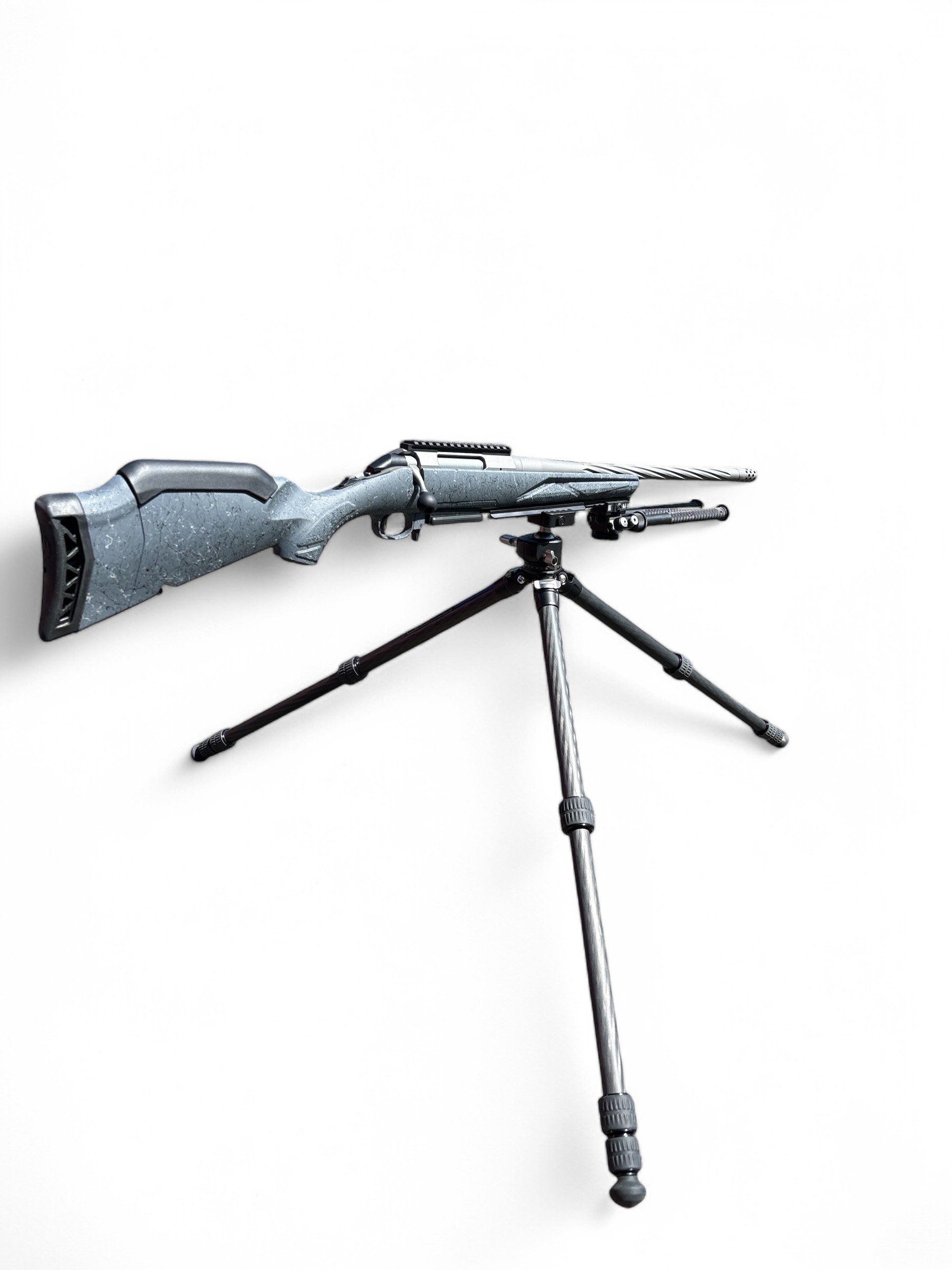 Tactical rifle equipped with bipod for stability.