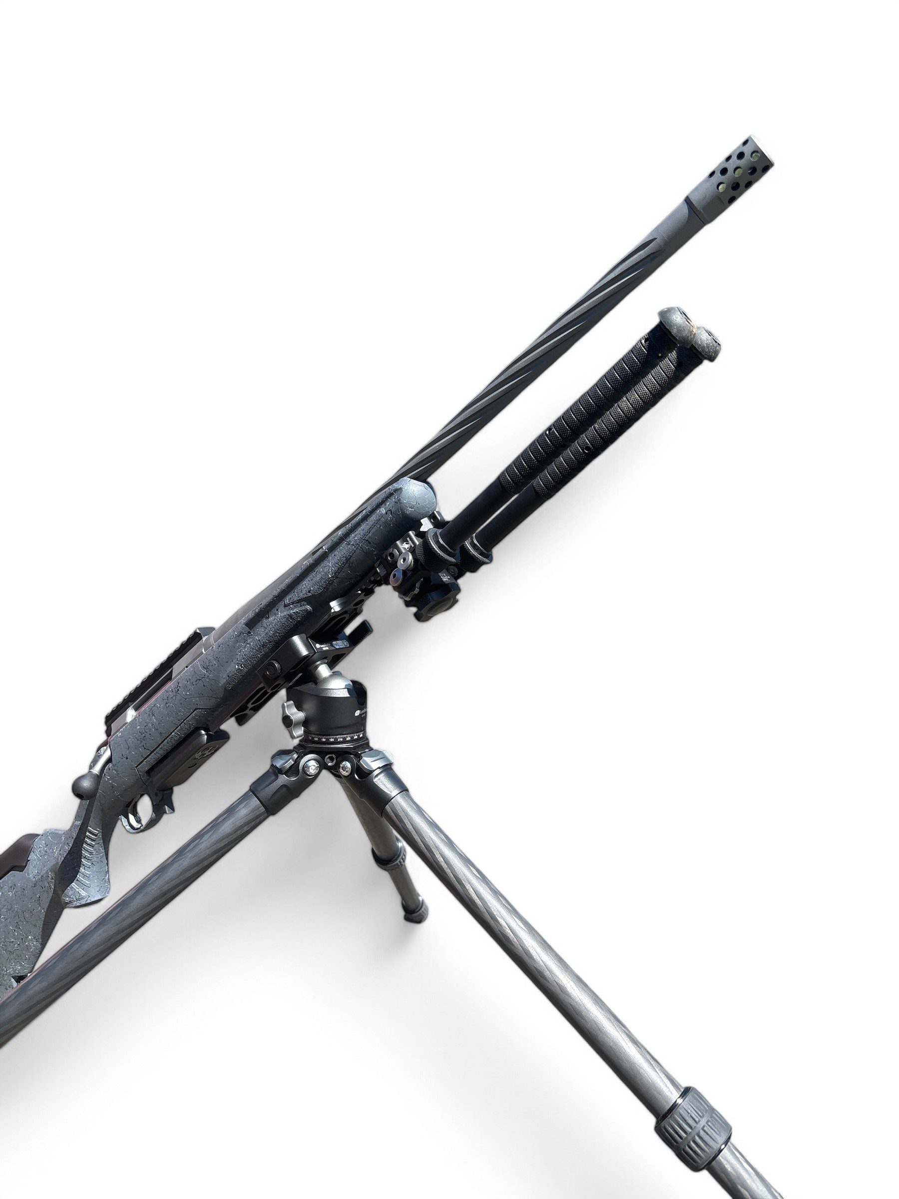 A sniper rifle mounted on a bipod with a scope.